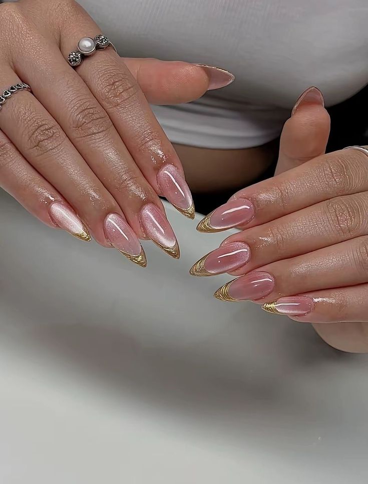 Pink shimmer with gold chrome French tips